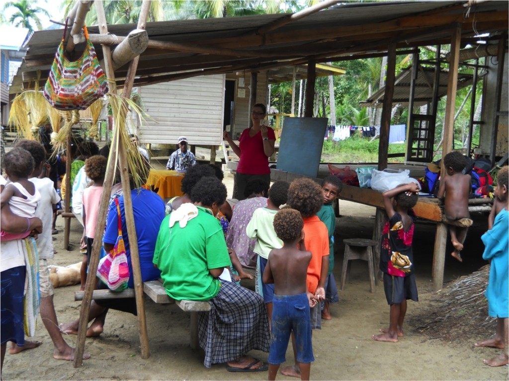 Christine Schreyer runs a workshop at which young and old learn their own newly-created Kala alphabet.