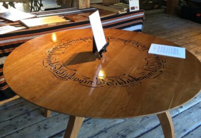Cherry dining table with blessing in Tibetan calligraphy